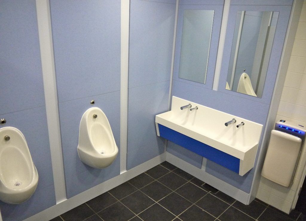 Blue school toilet room at Oxford & Cherwell Valley College.