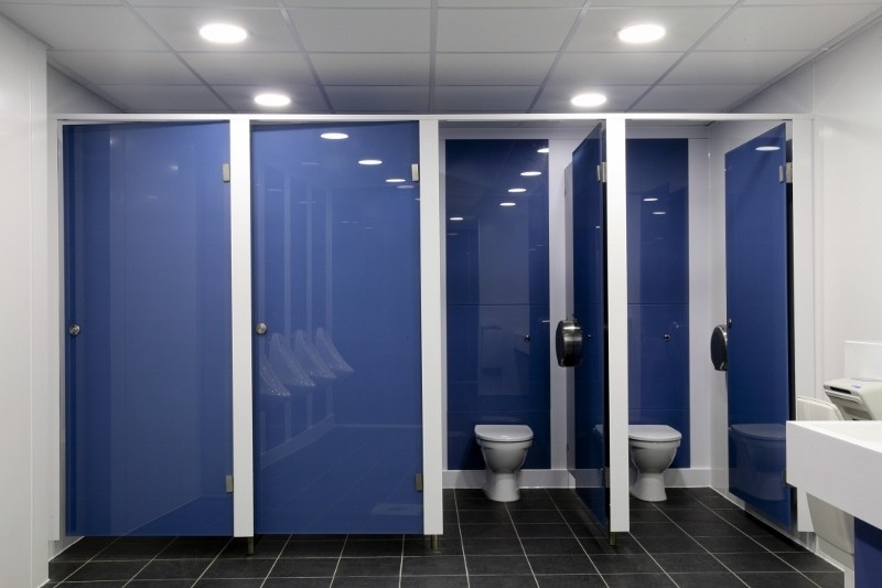 Toilet cubicles inside Ernest Bevin College washroom.