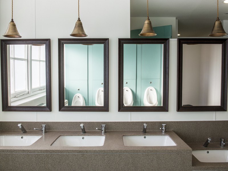 The sinks, hand dryers and mirrors inside Clivedon House washrooms.