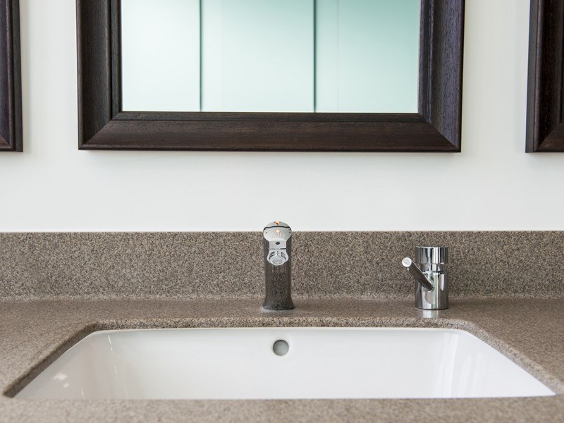 Photo of a sink and mirror.