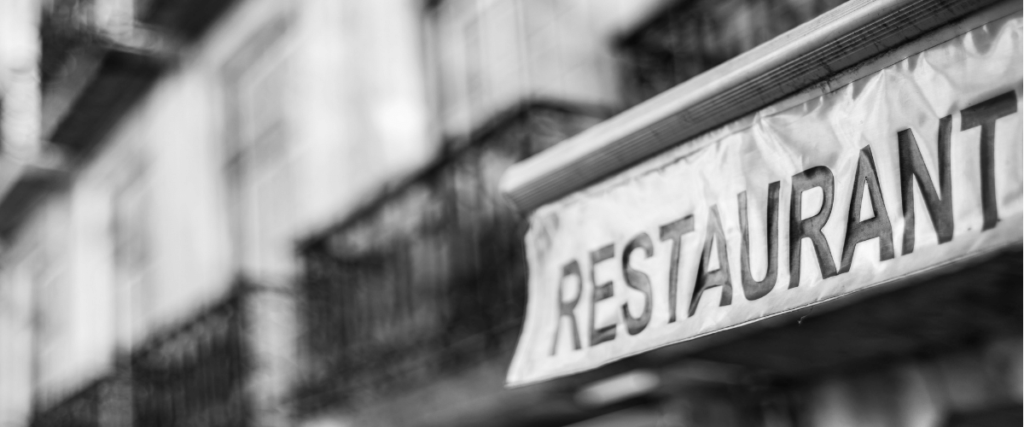 Black and white restaurant sign.