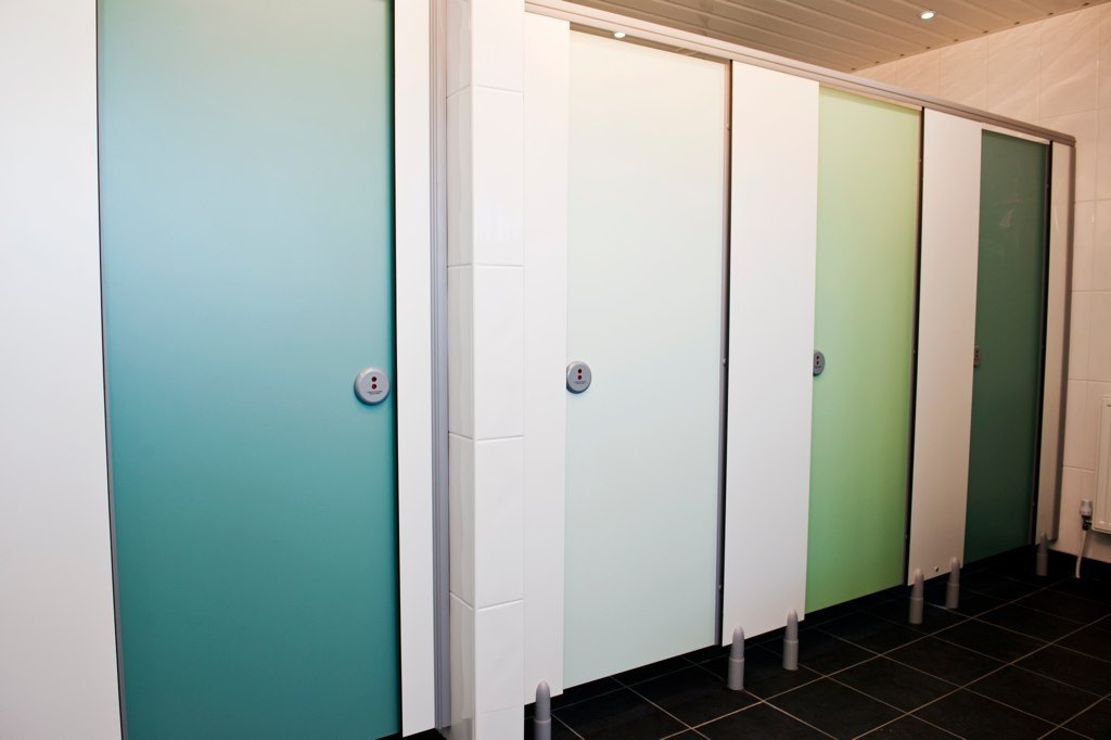 Different coloured toilet cubicles at Long Meadow Campsite.
