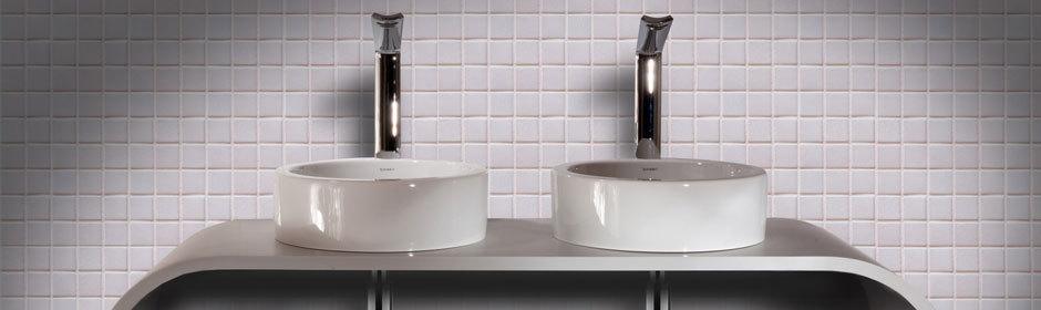 Two hand wash sinks inside an executive bathroom.