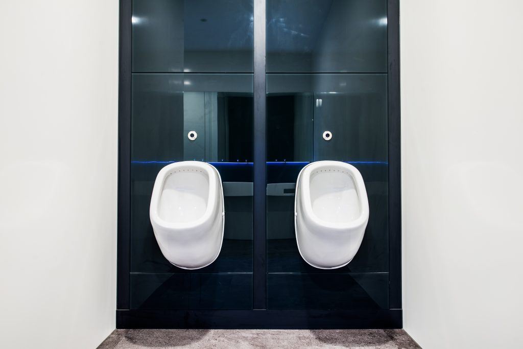 Two urinals inside an executive office bathroom.